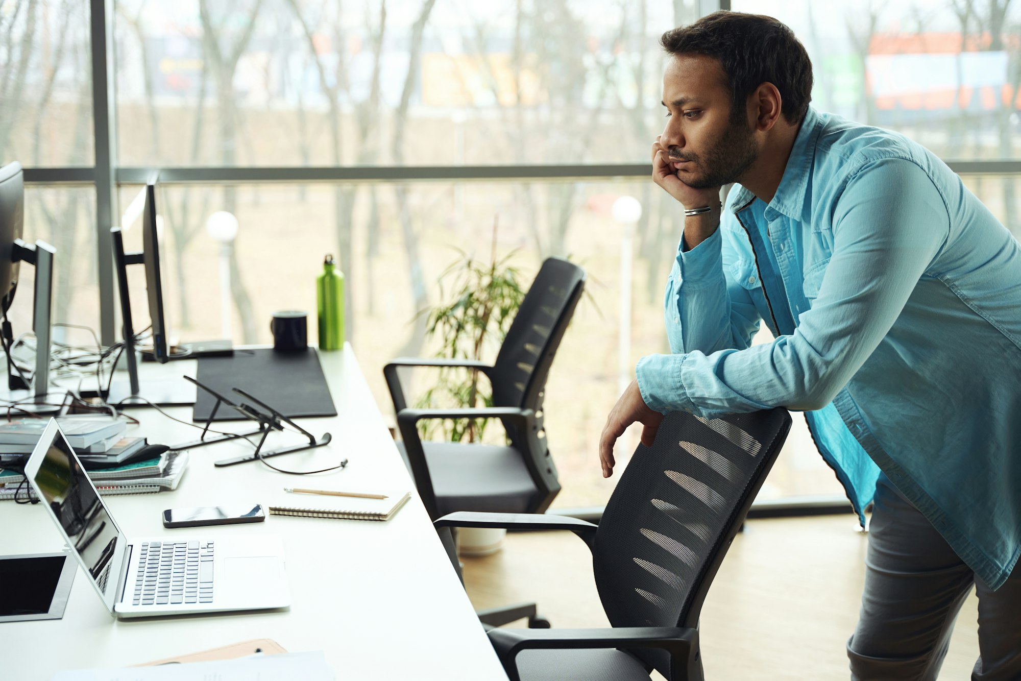 Man leaning on chair in the office