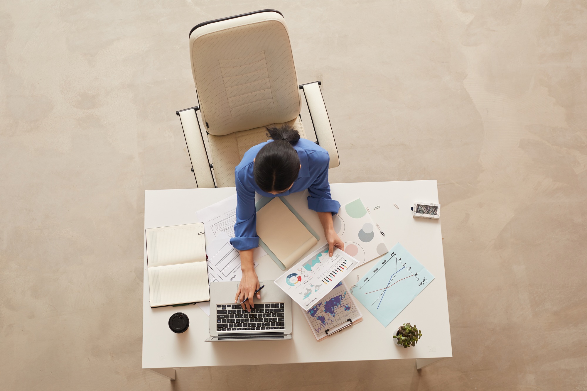 Businesswoman at Desk Top View