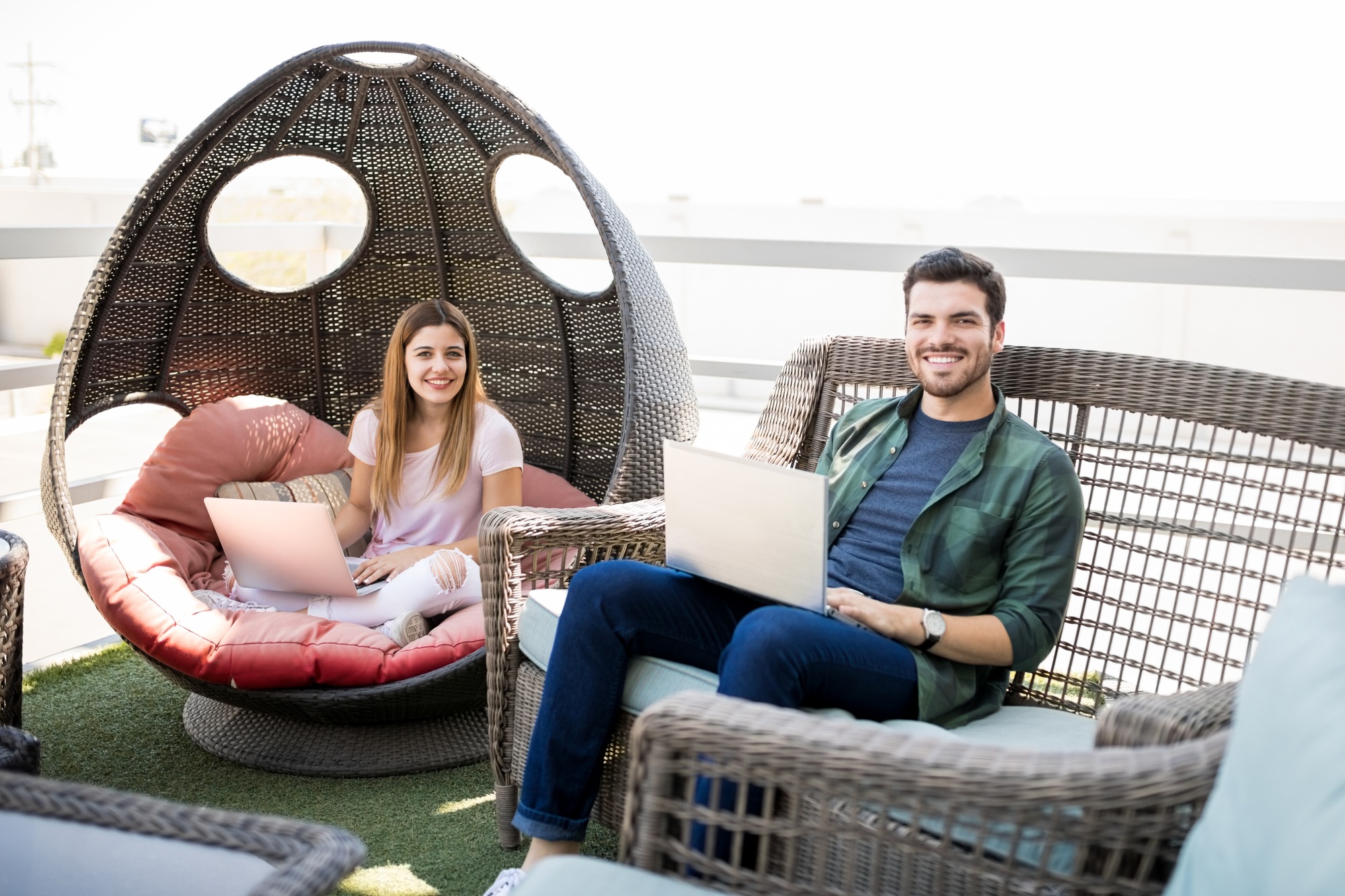 People relaxing in office lounge area