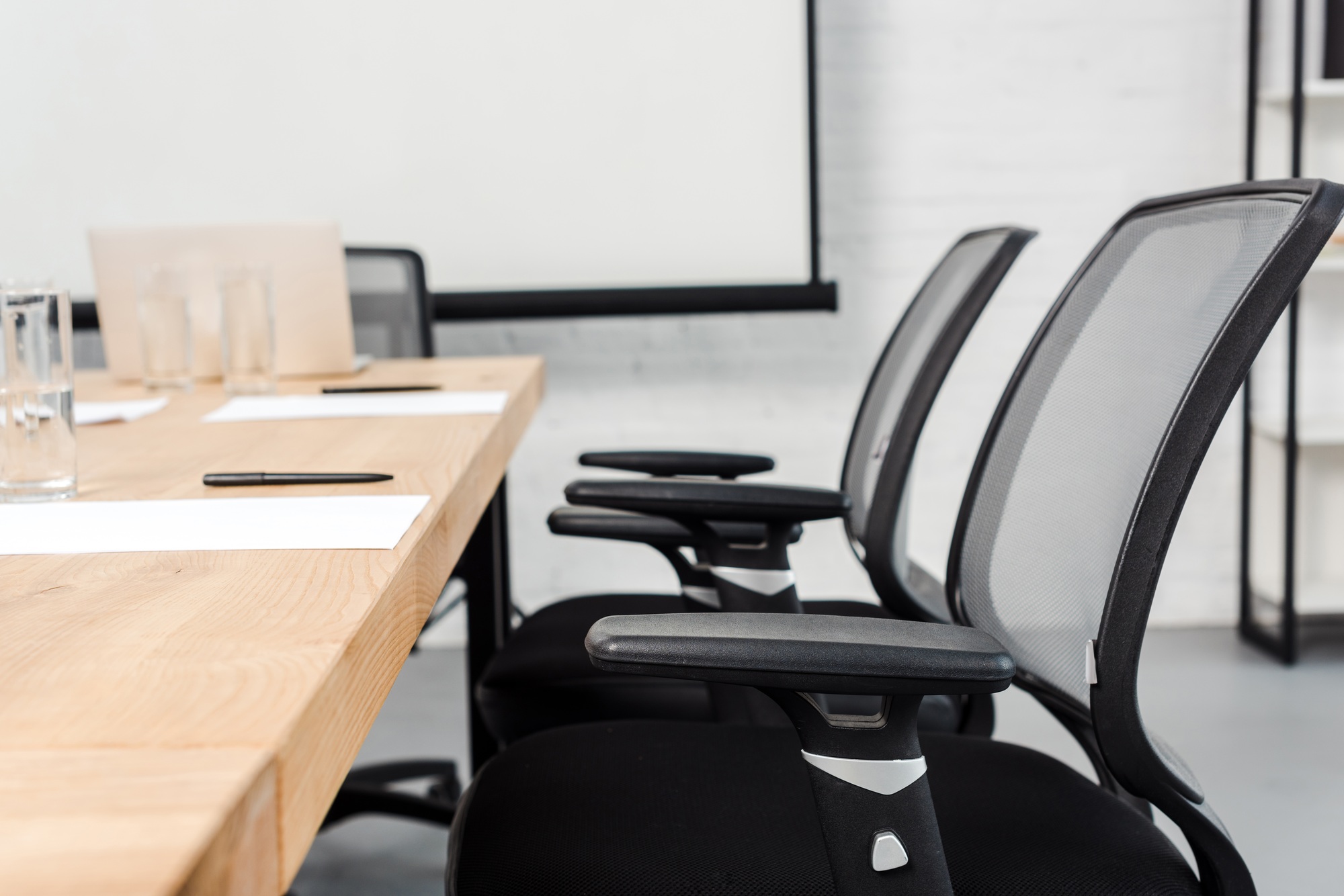 close-up shot of chair standing at conference hall of modern office