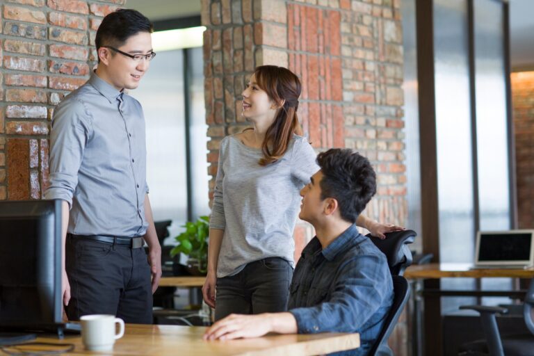 IT workers talking in office